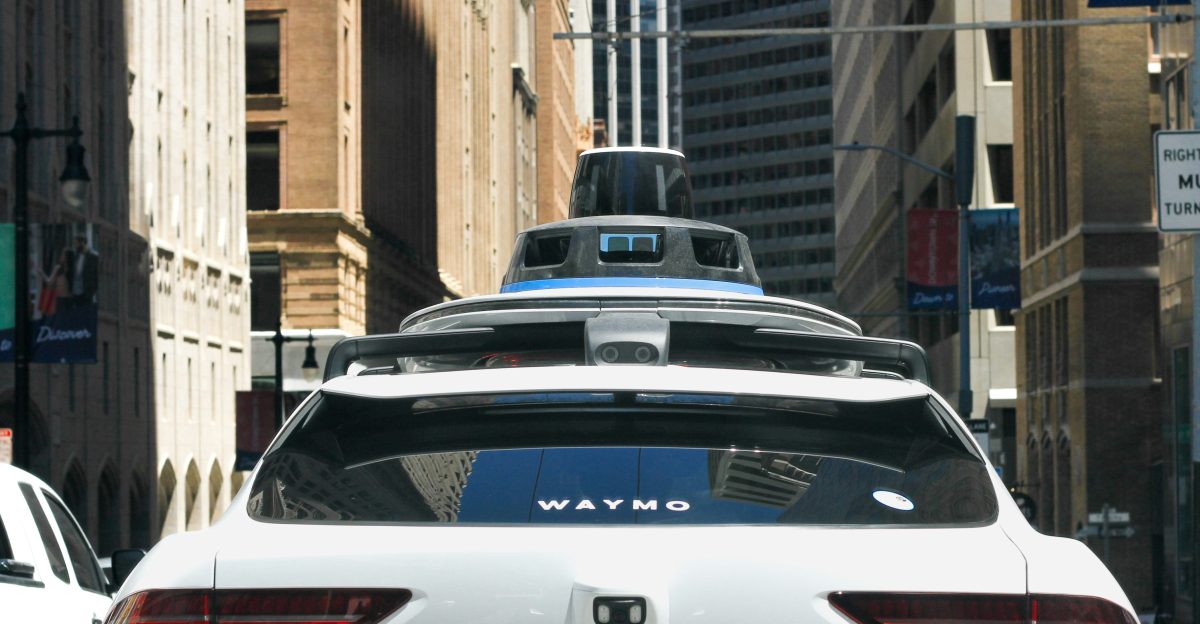 a car that is driving down the street