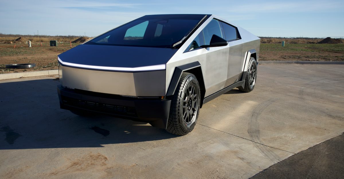 a silver and black car parked in a parking lot