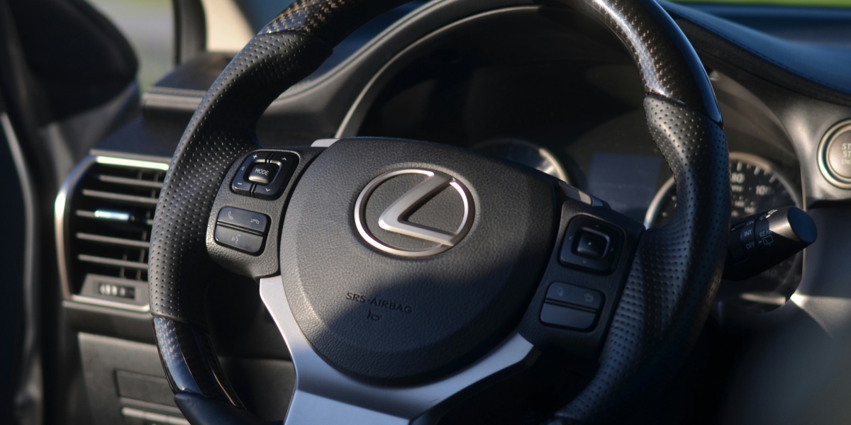 a steering wheel and dashboard of a car