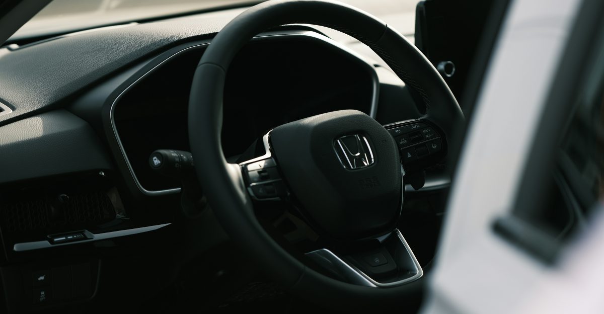 a steering wheel and dashboard of a car
