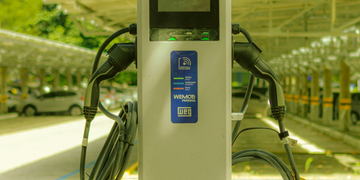 a parking meter sitting on the side of a road