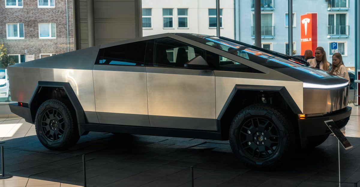 A futuristic car is on display in a building