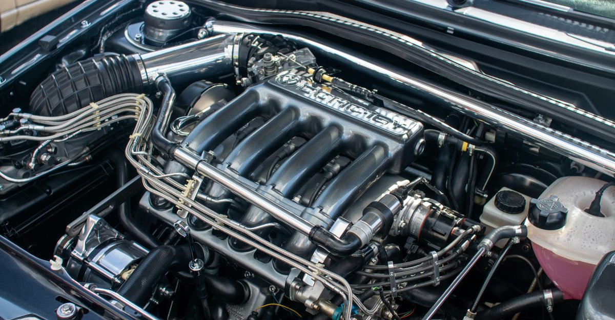 The engine compartment of a car with the hood up