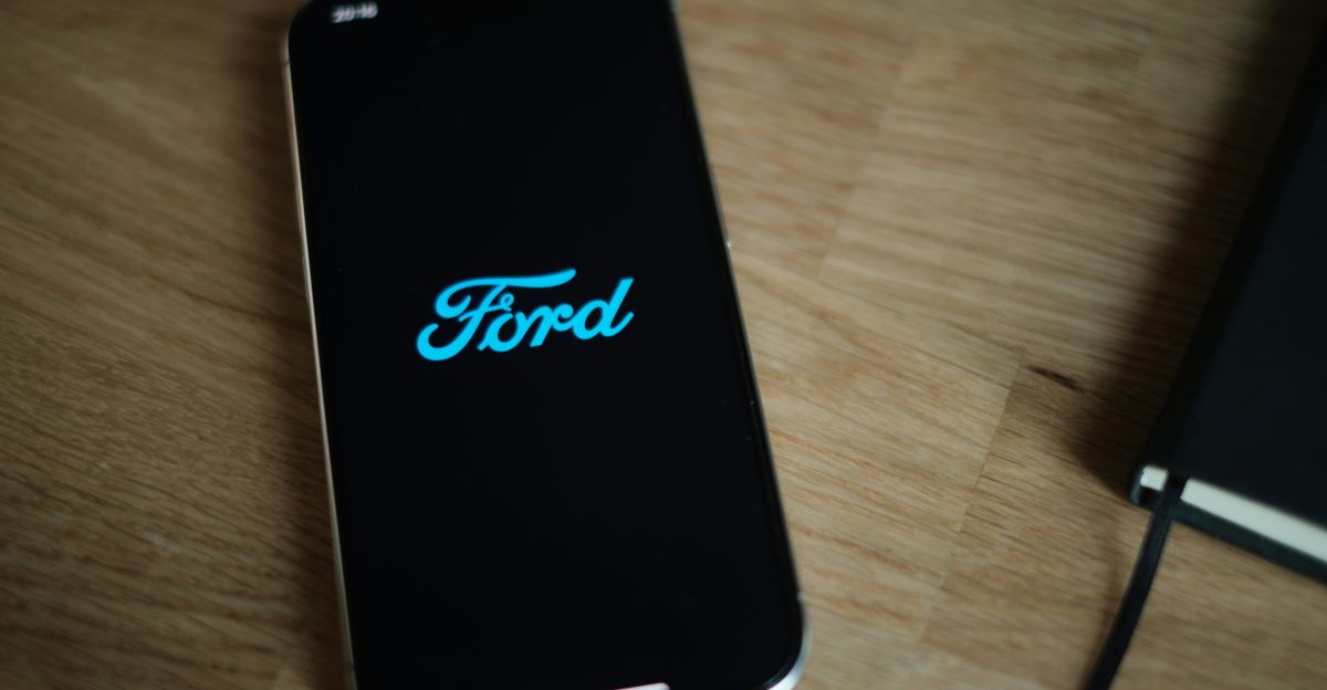 A cell phone sitting on top of a wooden table