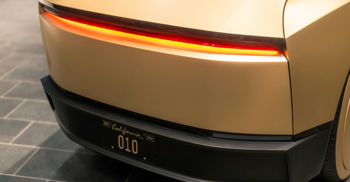 The rear end of a car on a tile floor