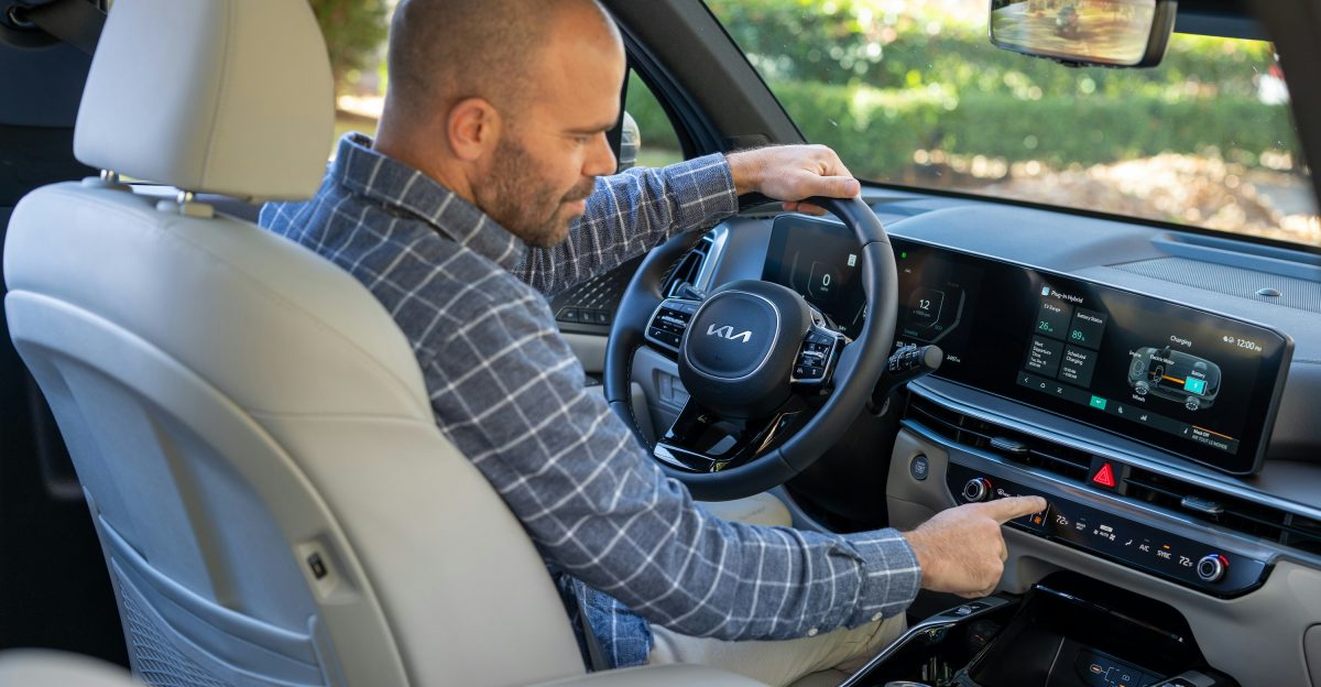 A man sitting in the driver s seat of a car