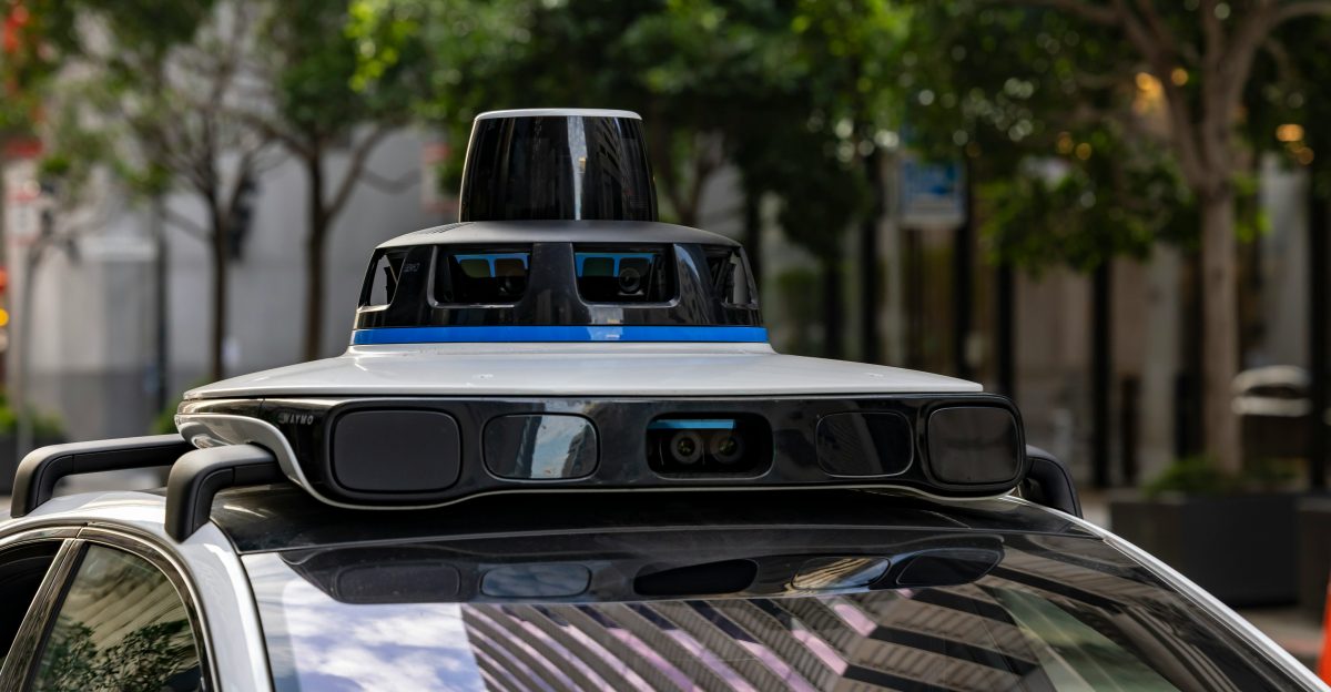 Self-driving car with sensors on city street