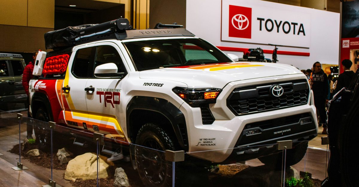 White toyota trd truck with colorful graphics on display