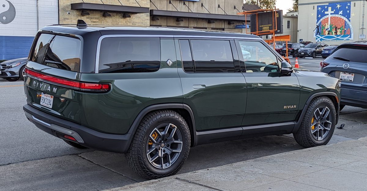 Rivian R1S sport utility vehicle in a dark green color parked on Howard Avenue in Burlingame California