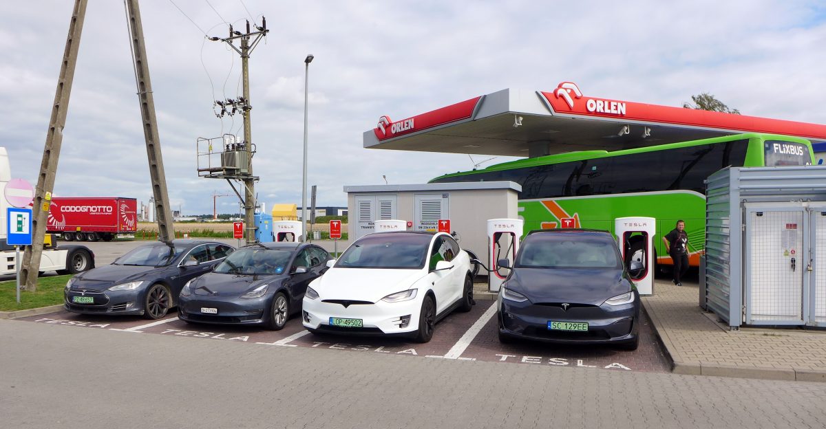 A lineup of four Teslas L-R a Model S a Model 3 and two Model Xs at the Tesla Supercharger Orlen petrol station Wichr w Lower Silesian Voivodeship Poland