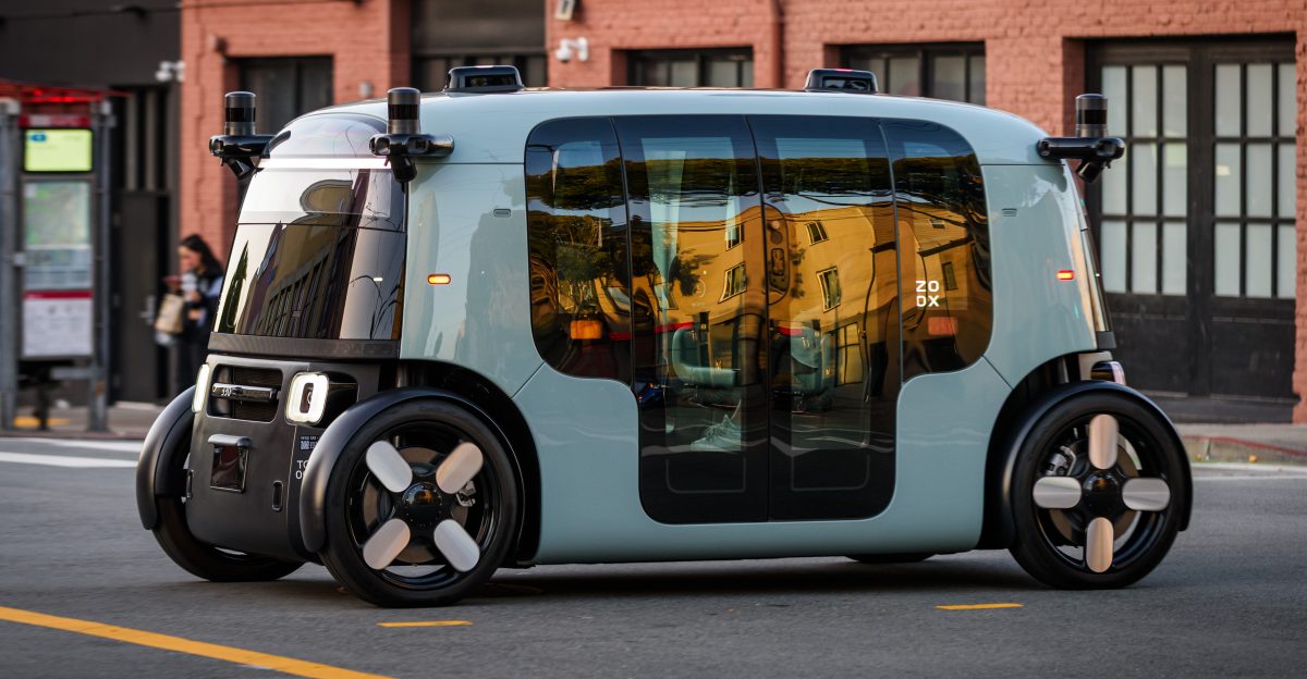 An occupied Zoox Robotaxi crosses Potrero St in San Francisco