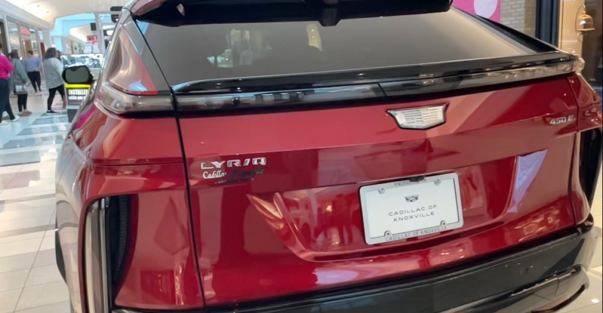A red 2024 Cadillac Lyriq at a shopping mall