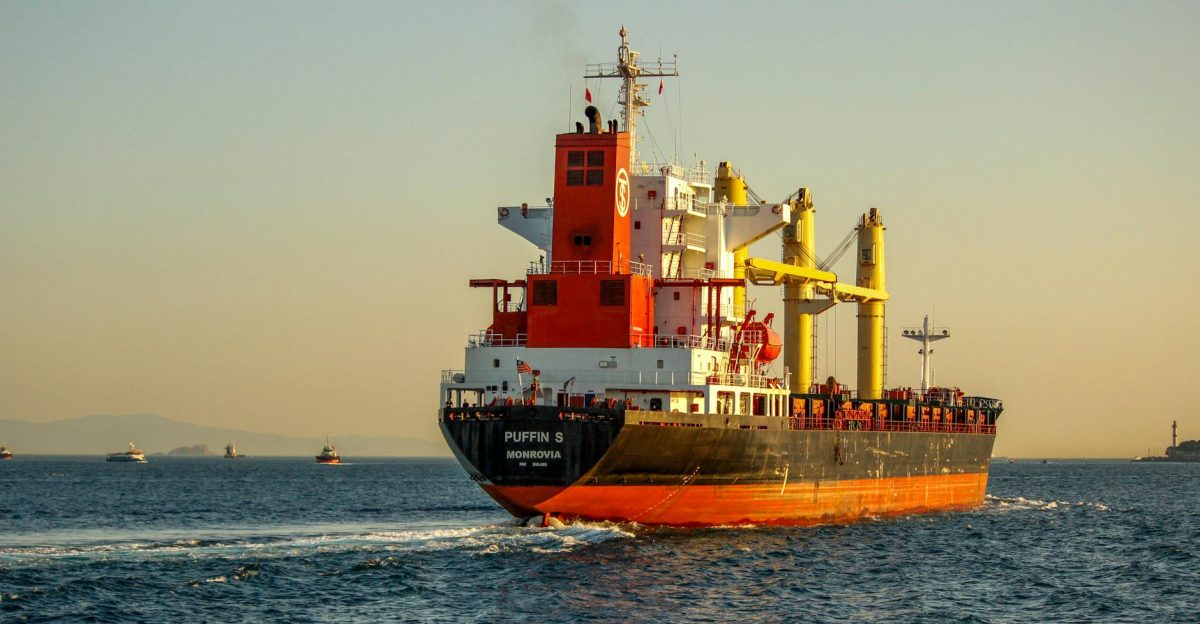 A vibrant container ship navigating the Bosphorus Strait Istanbul during sunset enhancing the maritime scenery