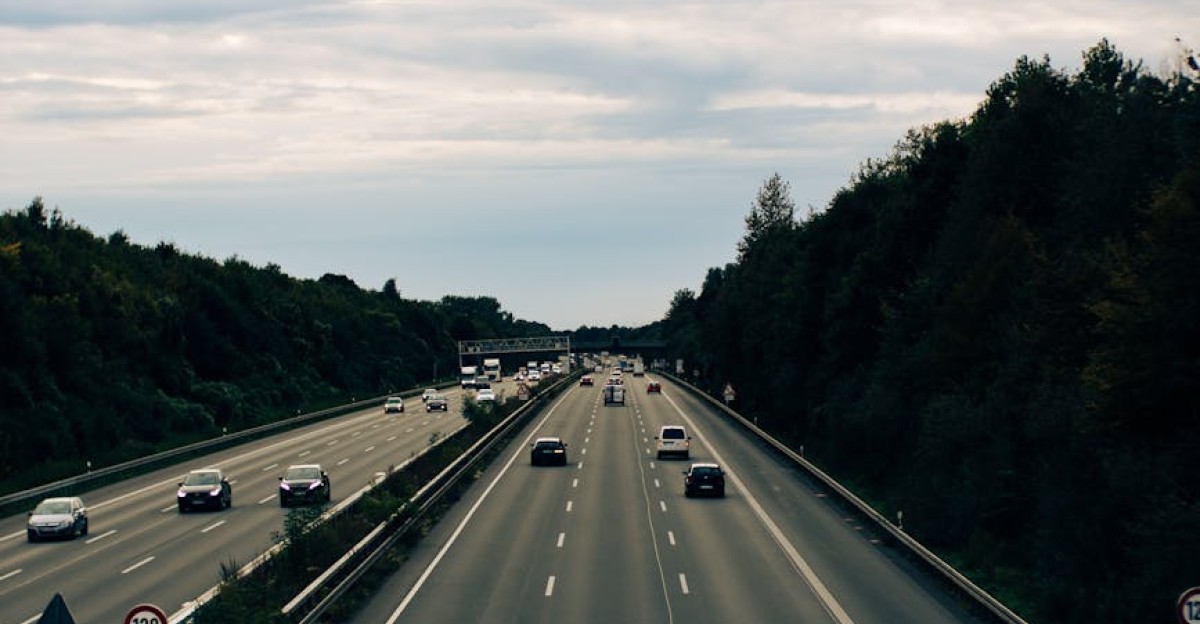 An aerial view of busy highway traffic in Dortmund Germany with lush greenery
