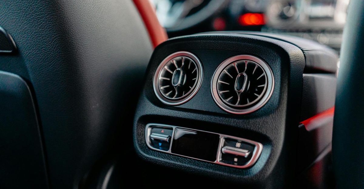 Close-up of a luxury car s air conditioning vents and controls highlighting interior design