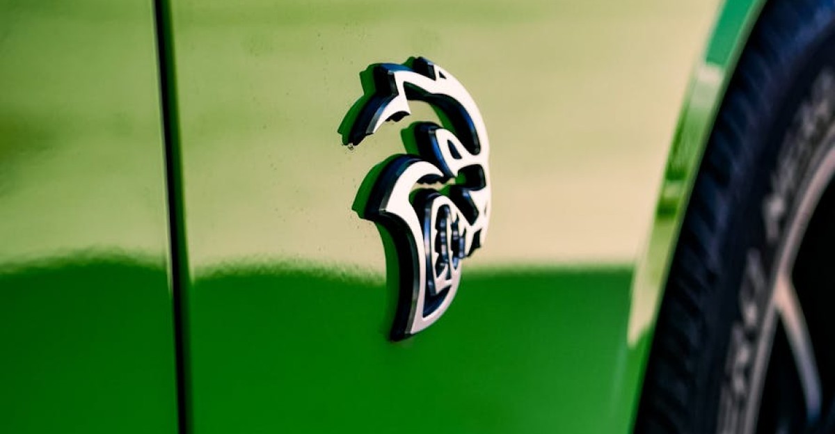 Close-up view of a green Dodge Challenger SRT Hellcat emblem on the fender