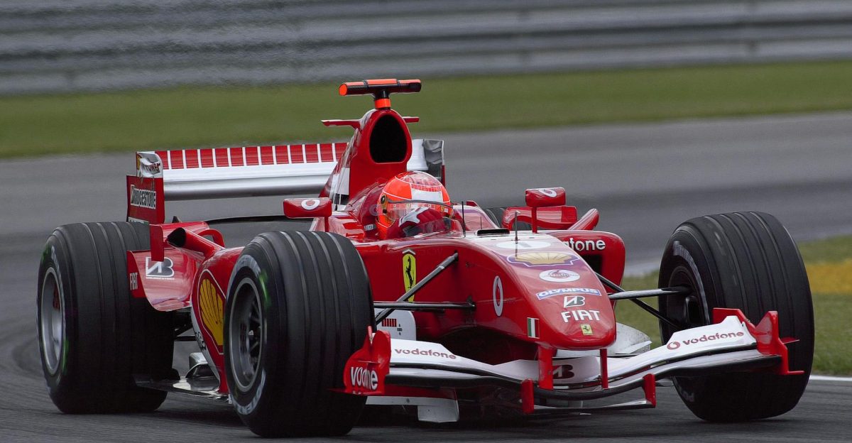 Ferrari Formula 1 car racing at high speed on the Indianapolis track showcasing motorsport excitement