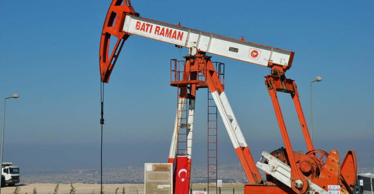 Bati Raman oil pump jack in Batman Turkey Industrial landscape with city view
