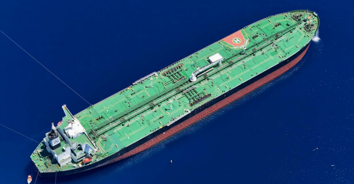 Aerial shot of an oil tanker sailing in the ocean near Vado Ligure Italy