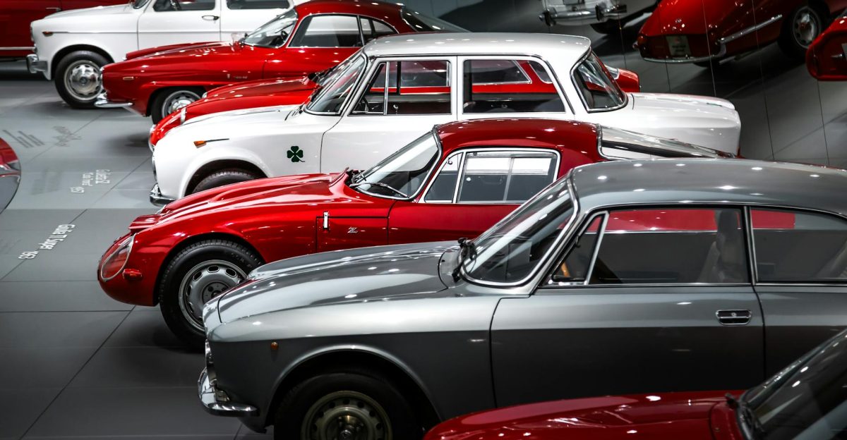 A striking collection of vintage Alfa Romeo cars showcased beautifully in a museum setting