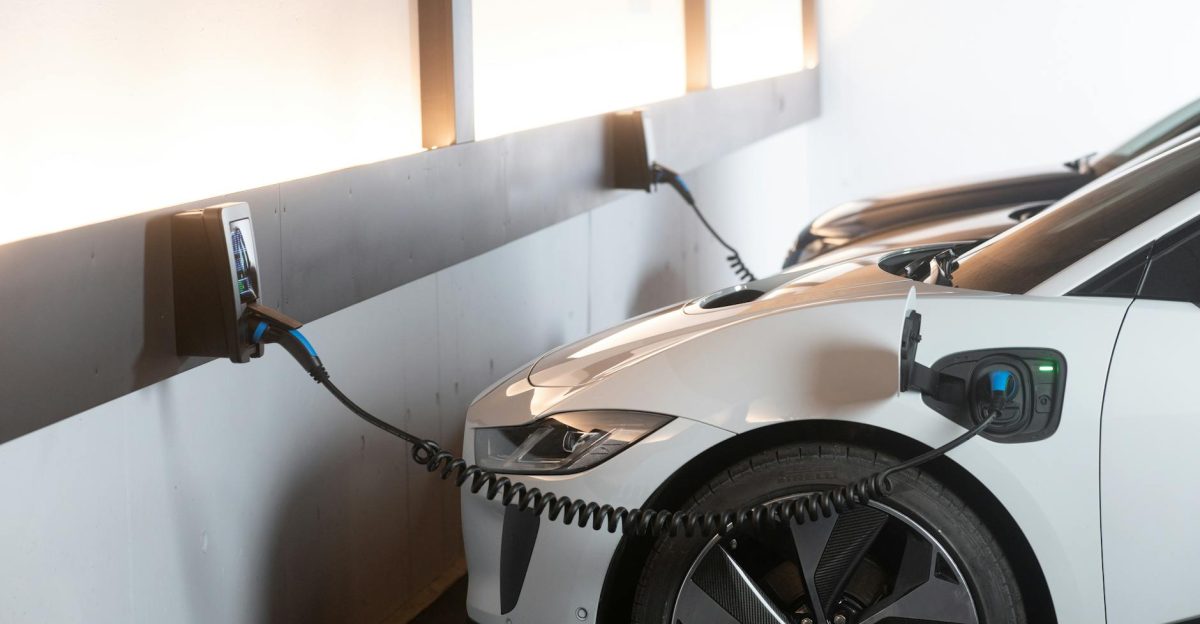 Electric car charging in a modern indoor station promoting sustainability and energy efficiency