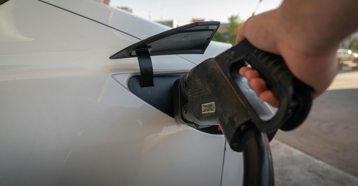 Close-up of electric car being charged highlighting eco-friendly transportation