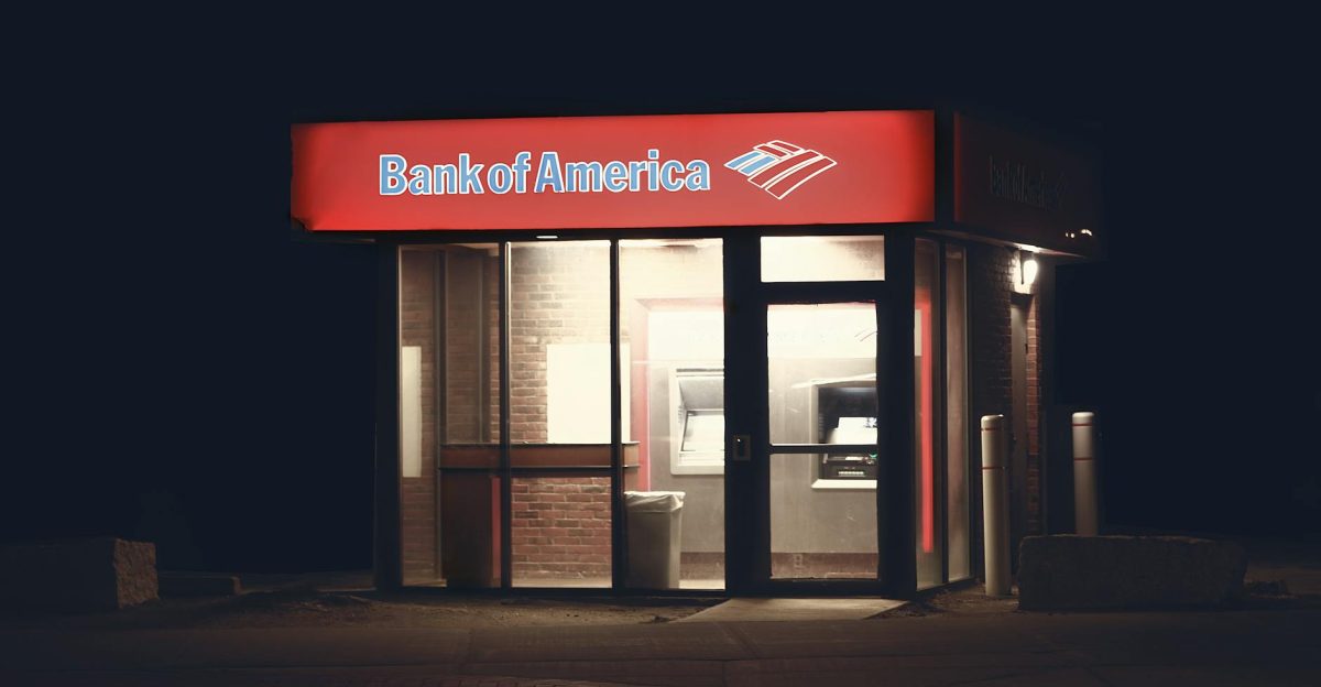 Illuminated Bank of America ATM structure against a dark nighttime backdrop in Boston