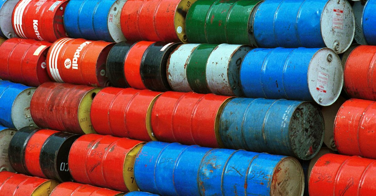 Vibrant stack of colorful industrial barrels ideal for environmental or industrial themed projects