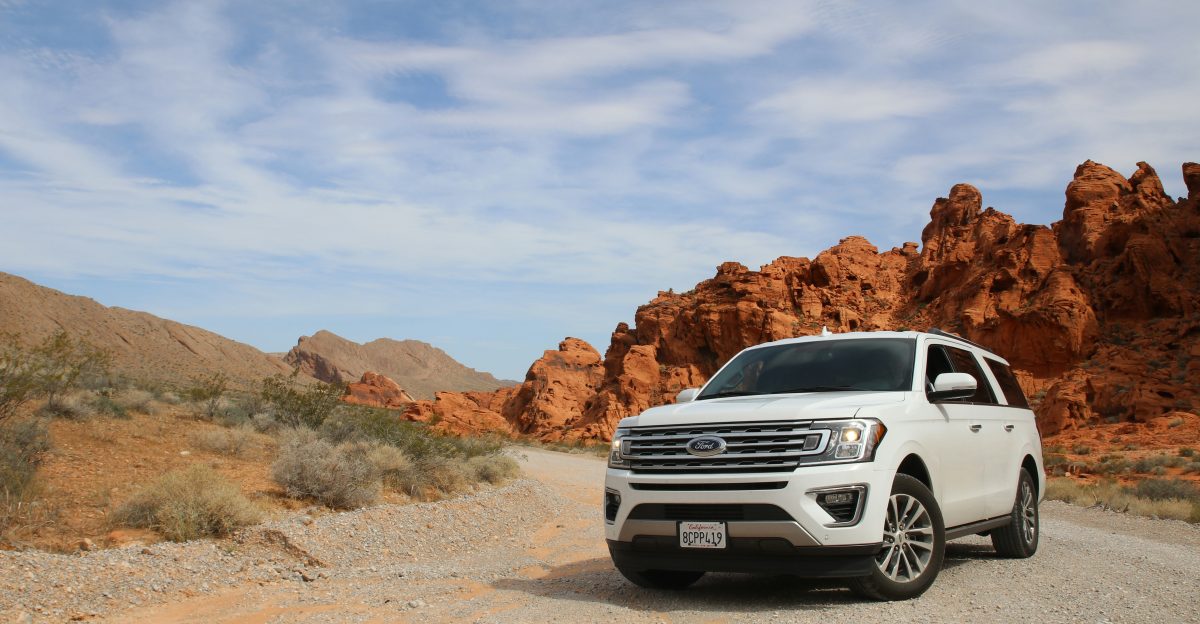 parked white Ford Explorer SUV