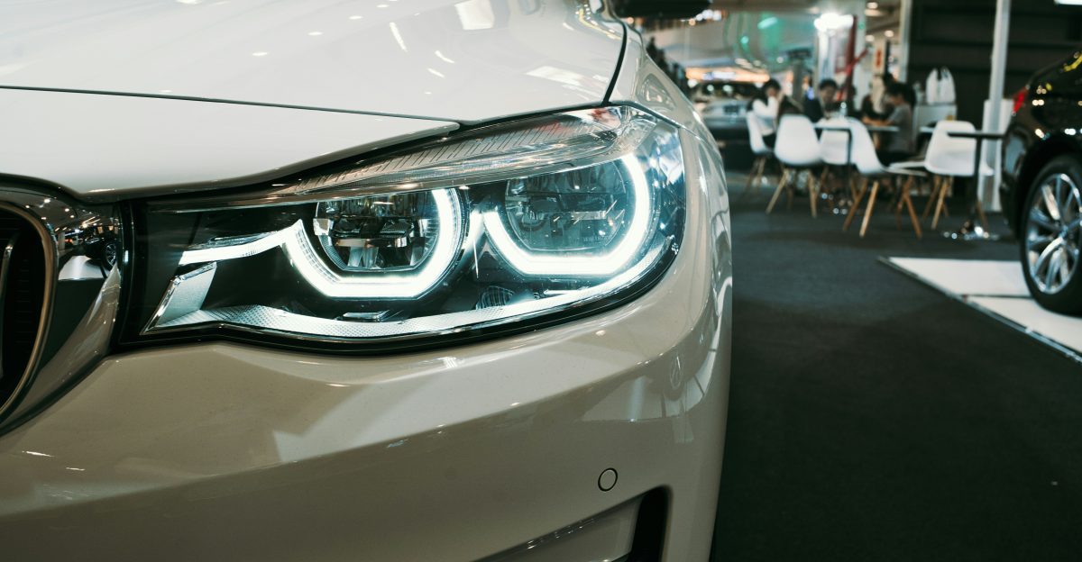 a close up of a car on a showroom floor