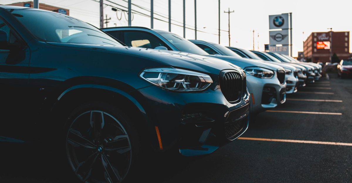 a row of cars parked in a parking lot
