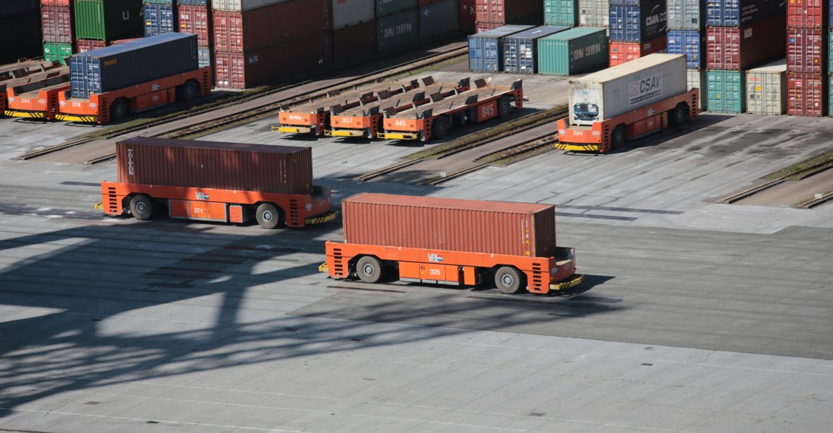 red and white truck on road during daytime