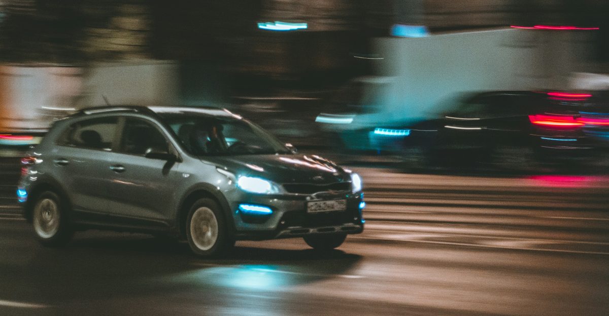 black sedan on road during night time
