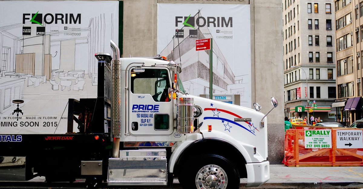 white and blue truck on road during daytime