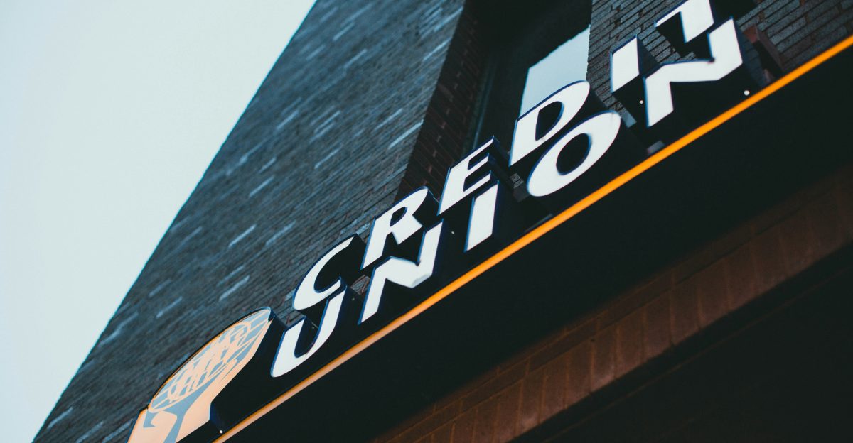 a sign on the side of a brick building