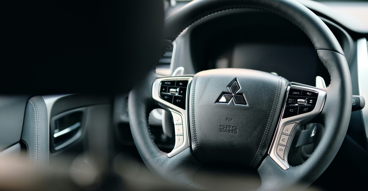 black honda steering wheel in close up photography