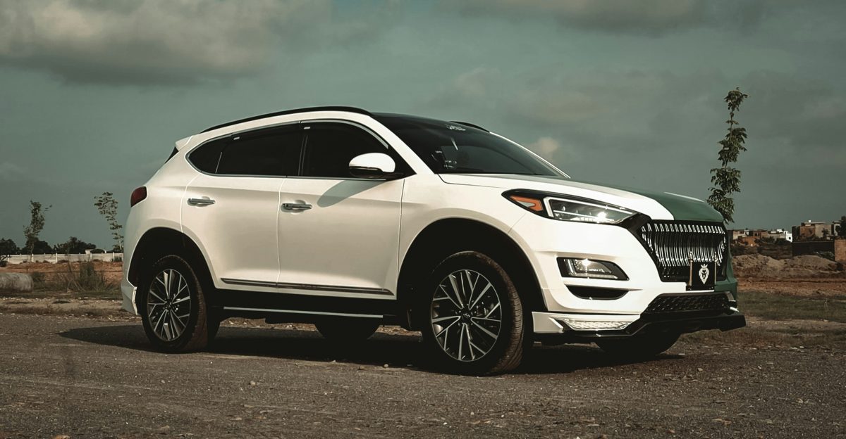 white honda car on gray asphalt road