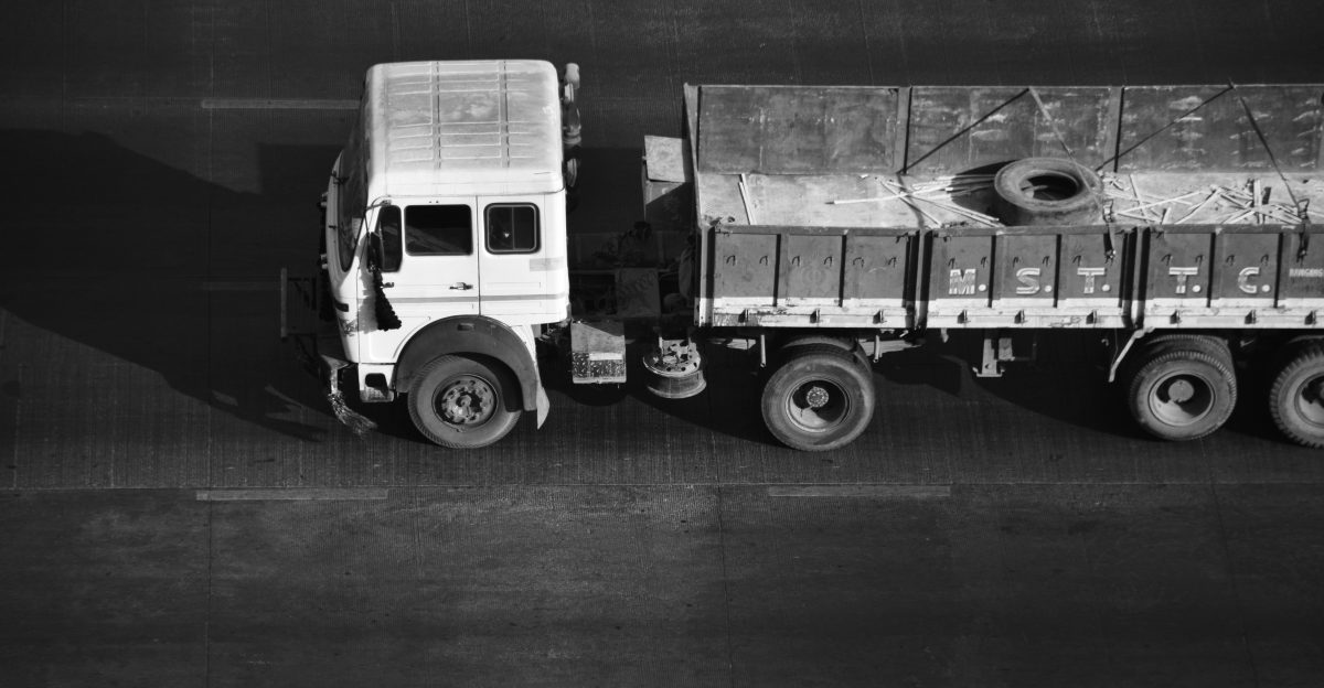 a black and white photo of a truck