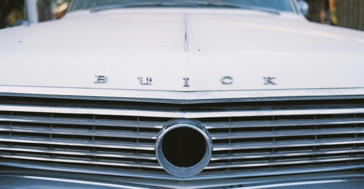 a close up of the front end of a classic car