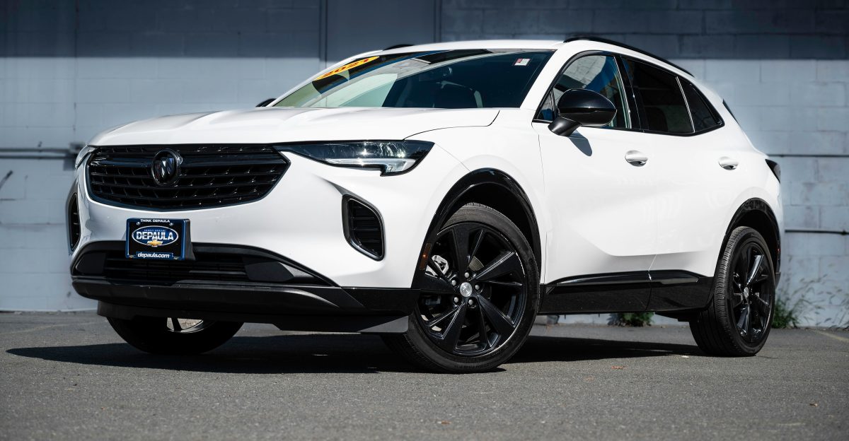 a white car parked in front of a building