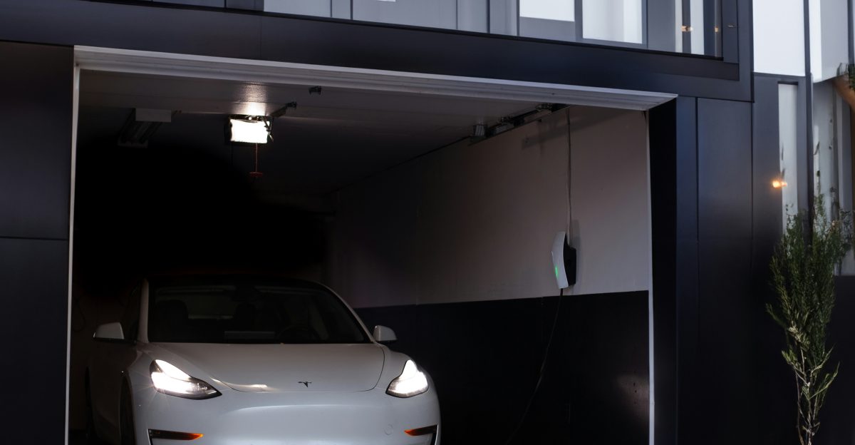 a white car is parked in a garage