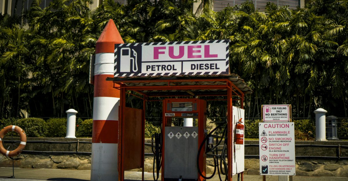 a gas station with a rocket on top of it