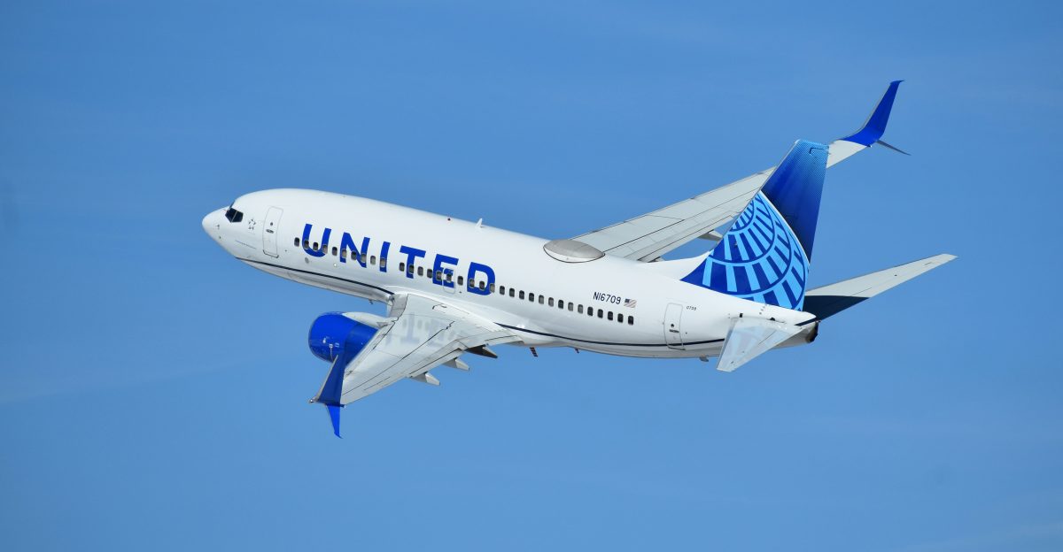 a united airlines plane flying in the sky
