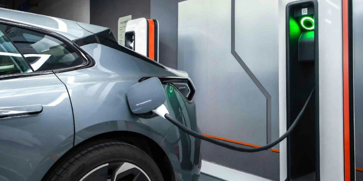 An electric car being charged at a charging station