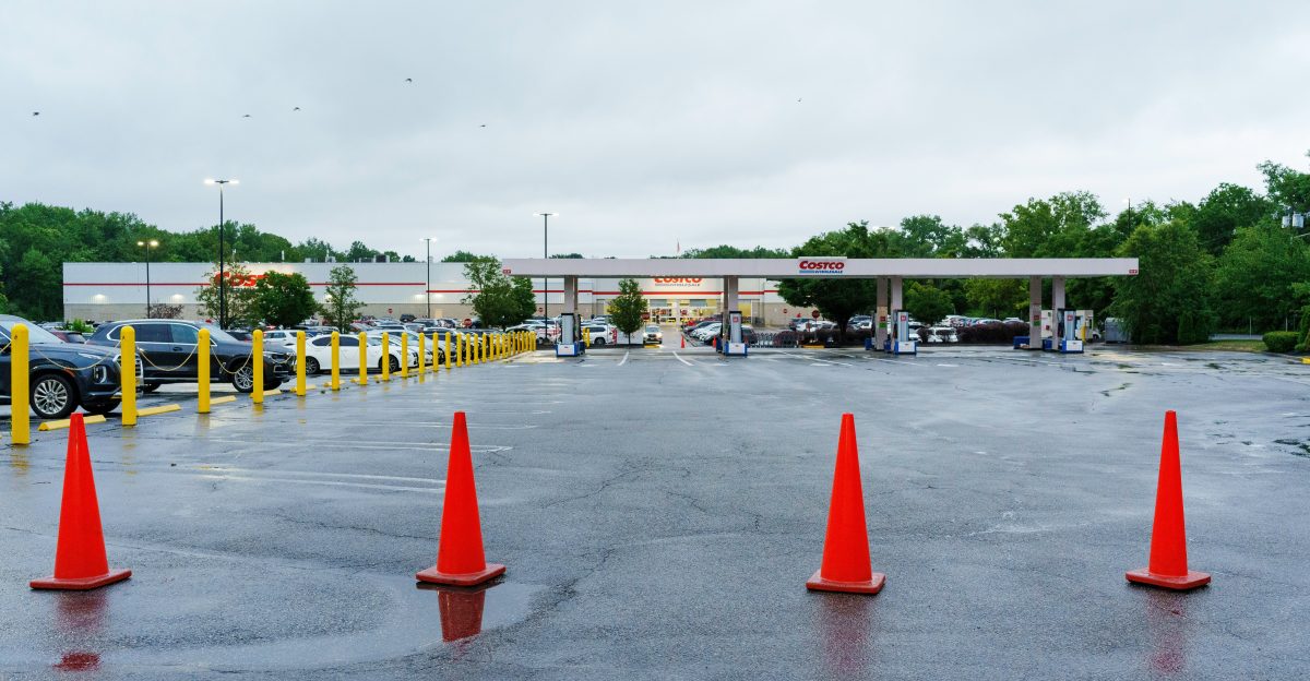 A parking lot filled with lots of orange cones