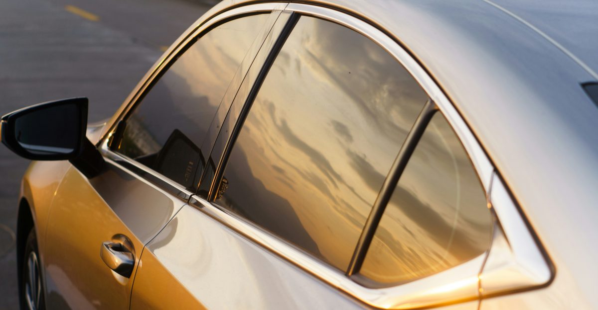 A silver car parked on the side of the road