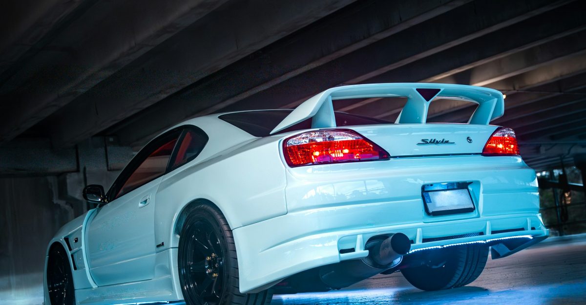 White sports car with blue underglow lights