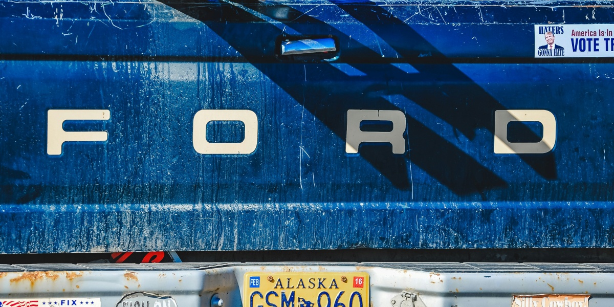 Blue ford truck tailgate with alaska license plate