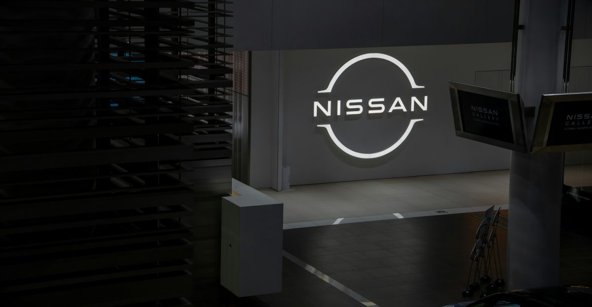 Nissan logo illuminated on a dark background